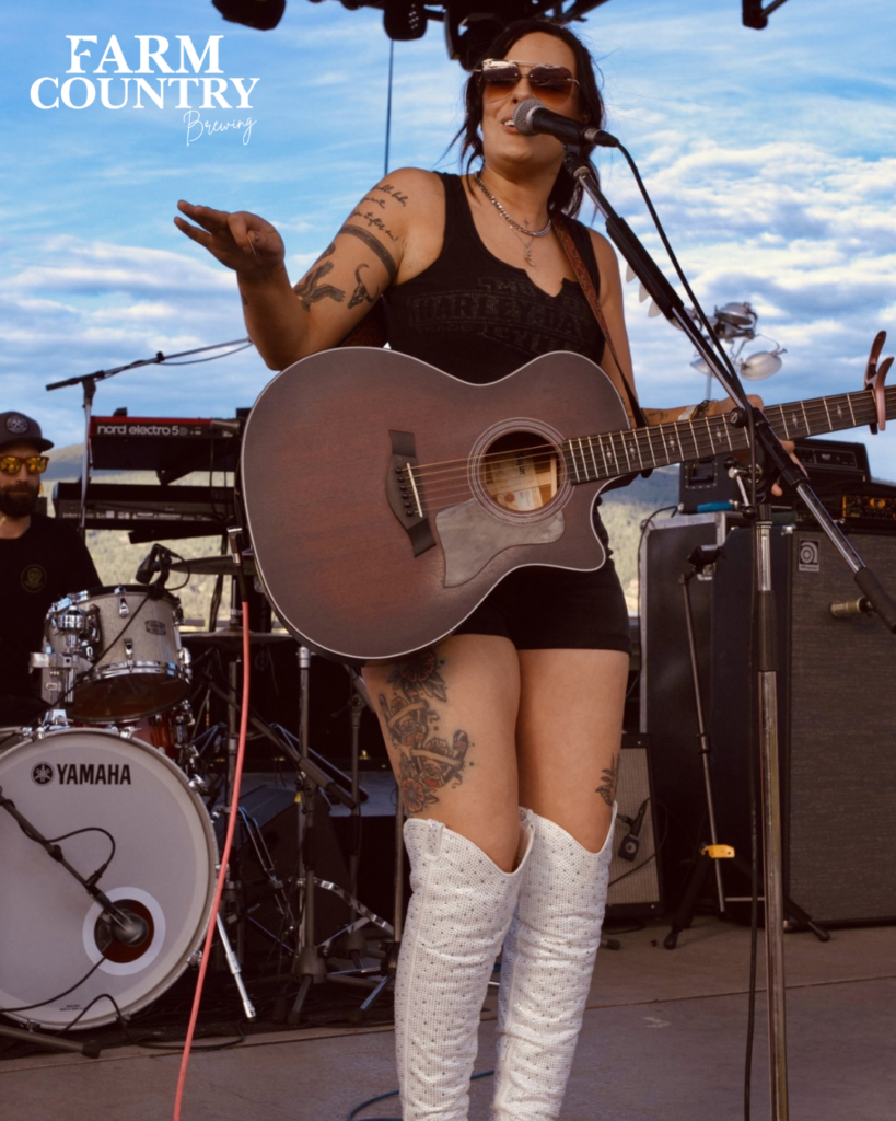 women performer with guitar